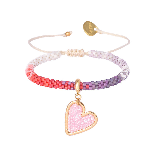 Adjustable beaded gold plated bracelet with charms