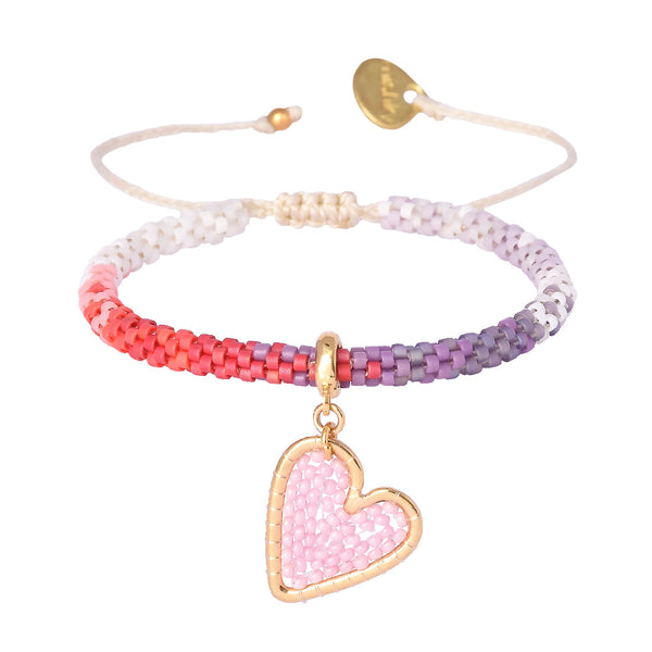 Adjustable beaded gold plated bracelet with charms