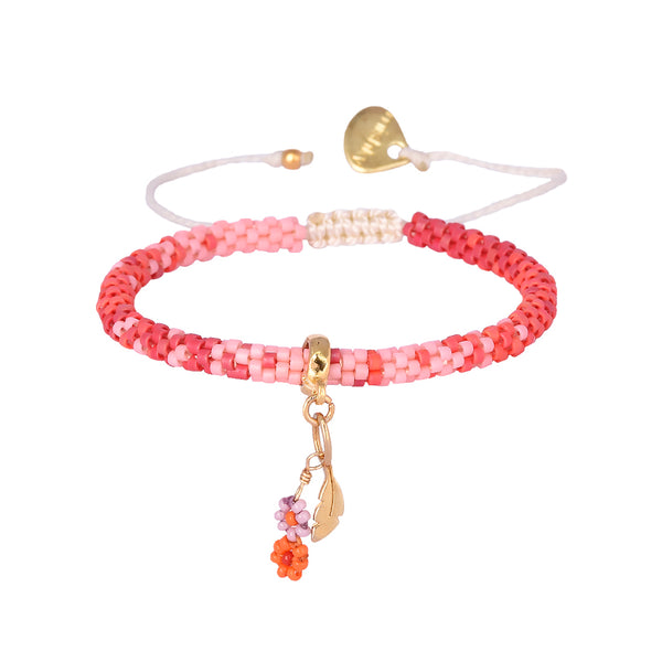 Adjustable beaded gold plated bracelet with charms